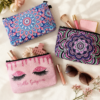 Zippered fabric cosmetic bags flat lay with makeup and accessories