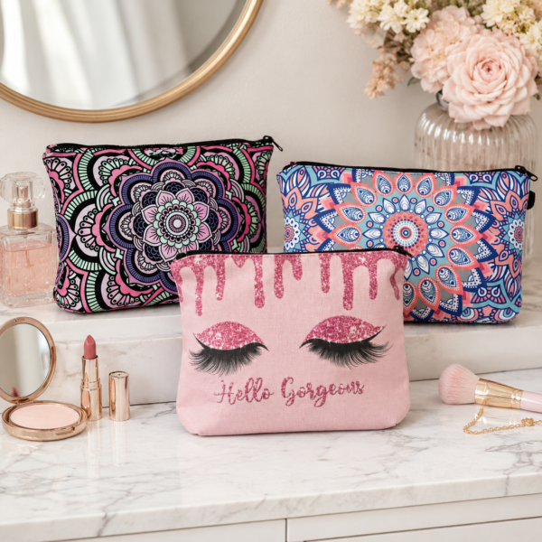Zippered fabric cosmetic bags displayed on a vanity with beauty accessories